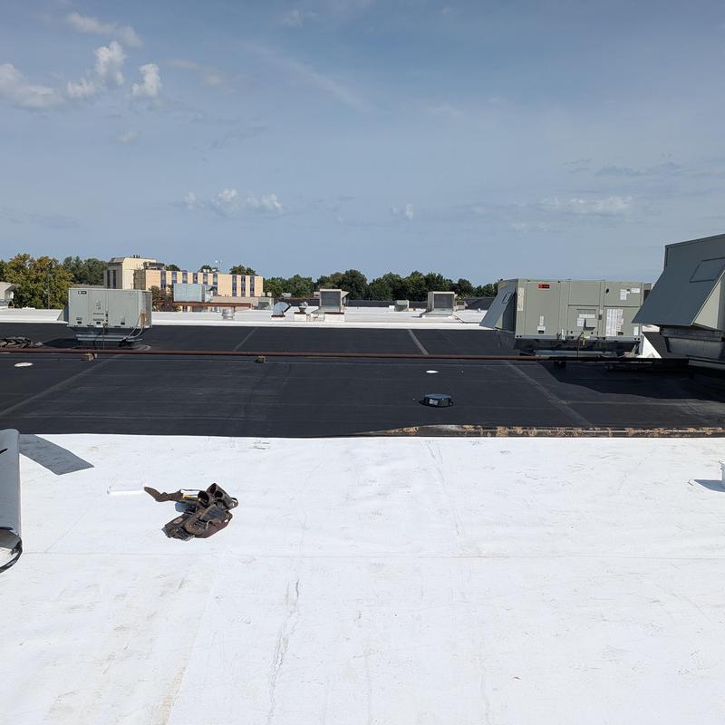 Commercial flat roof restoration on building rooftop