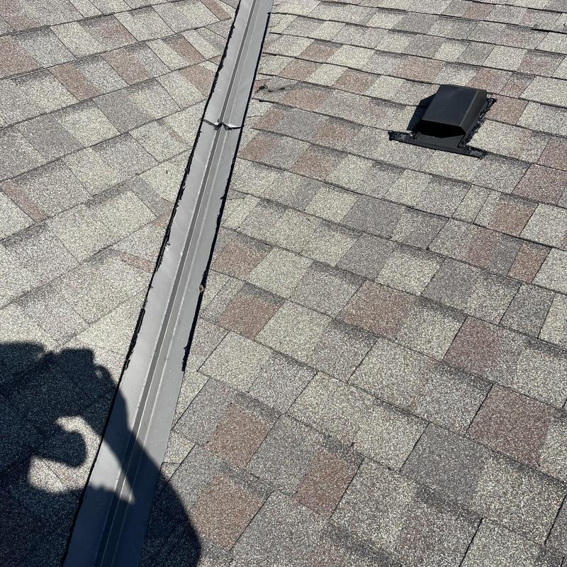 Roof valley flashing and shingles with vent pipe Roof valley flashing and shingles with vent pipe
