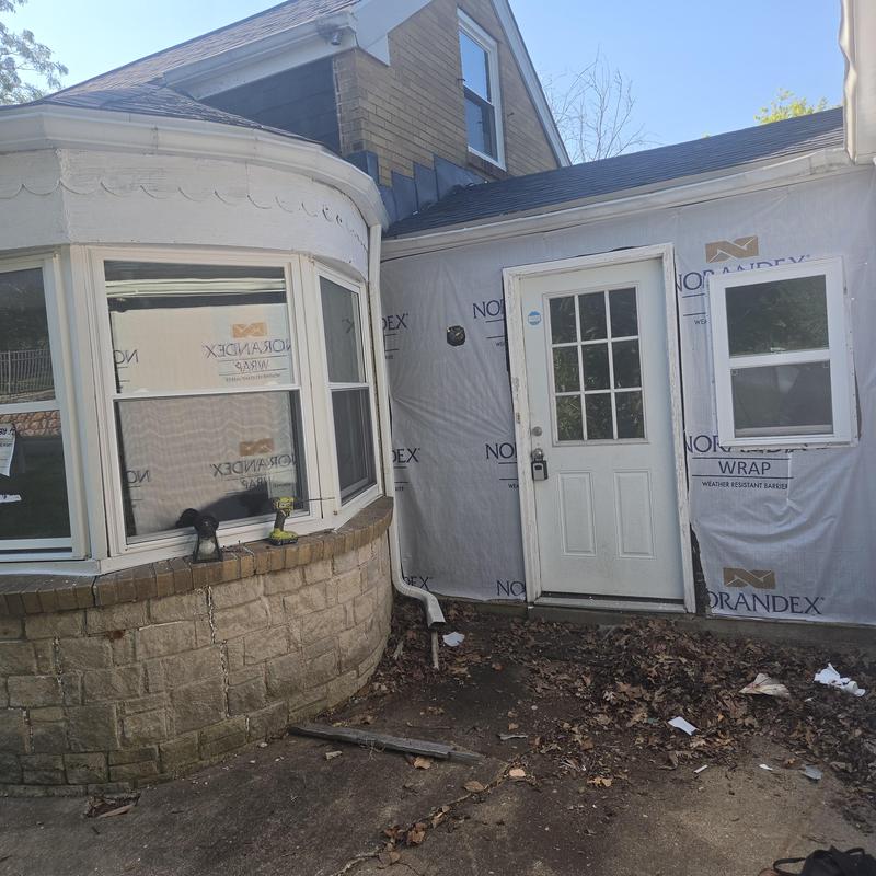 Window wraps and siding install with weather barrier Window wraps and siding install with weather barrier