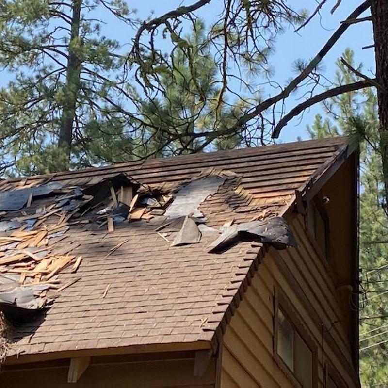 Asphalt shingle roof with severe damage and dry rot