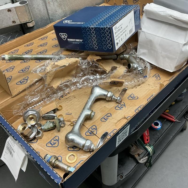 T&S wall-mount faucet assembly and parts on box T&S wall-mount faucet assembly and parts on box