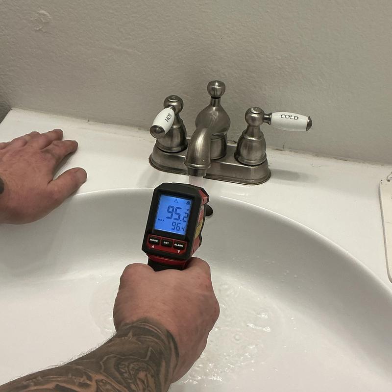 Bathroom faucet hot water temperature check with infrared gun Bathroom faucet hot water temperature check with infrared gun