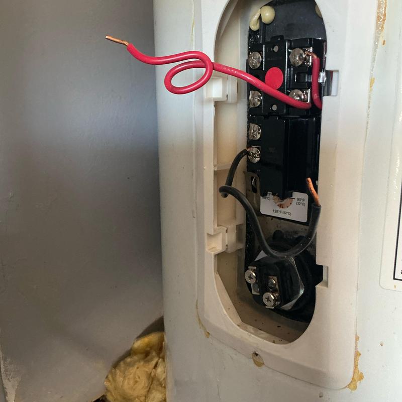 Water heater thermostat and wiring exposed during repair Water heater thermostat and wiring exposed during repair