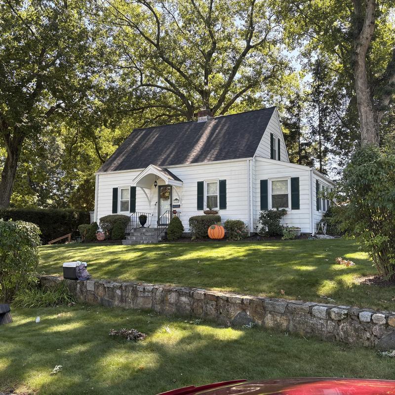 Asphalt shingle roof on white house in Bridgeport CT Asphalt shingle roof on white house in Bridgeport CT