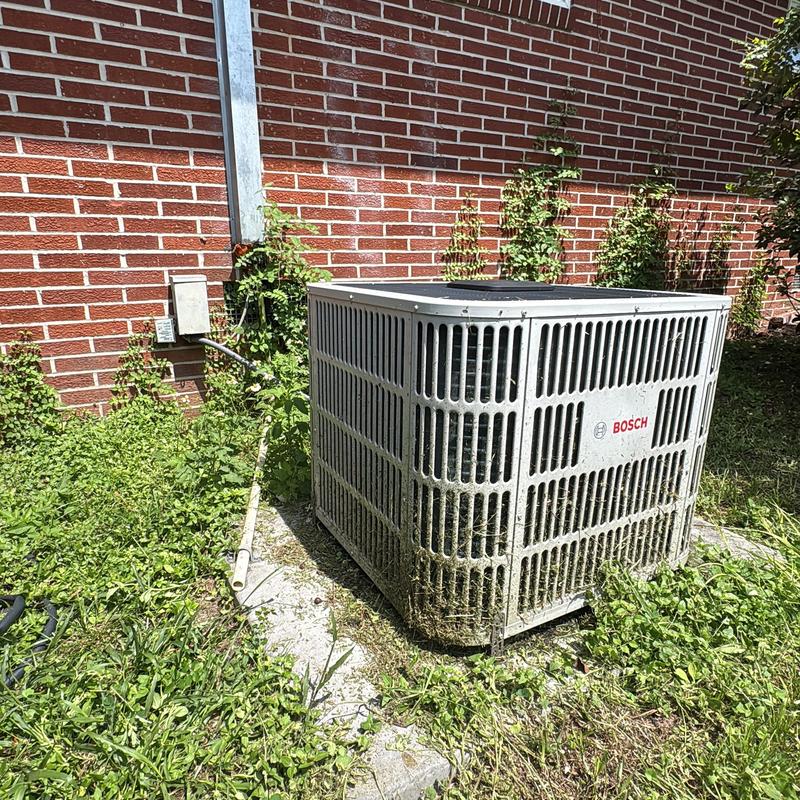 Bosch outdoor AC unit with visible dirt buildup Bosch outdoor AC unit with visible dirt buildup