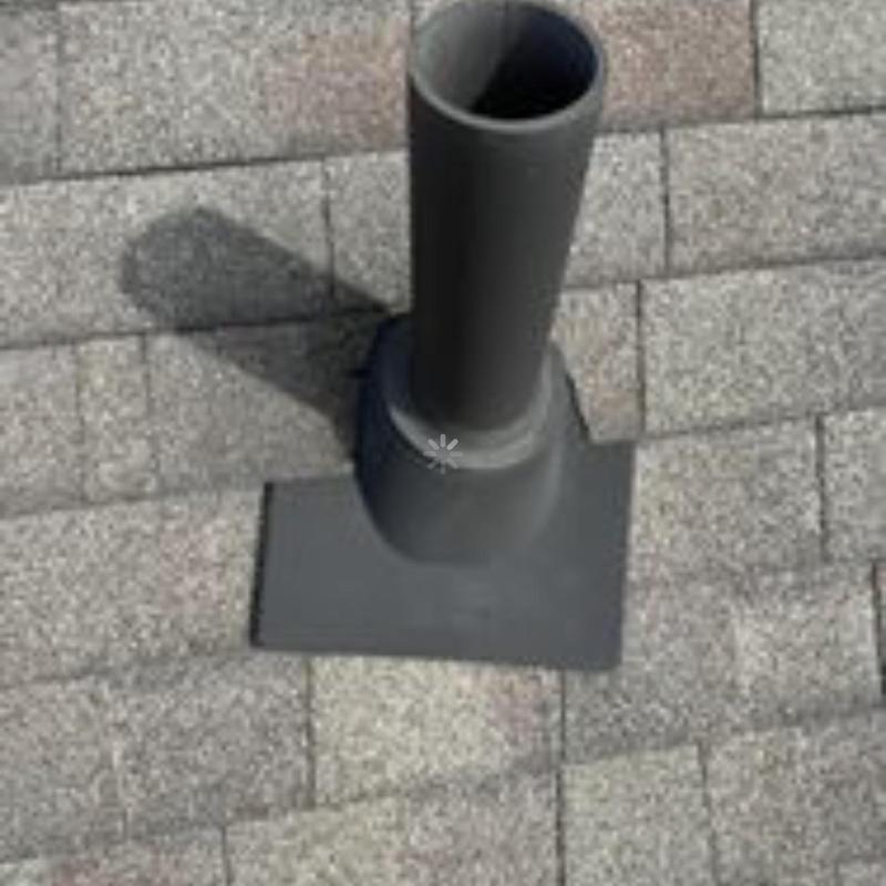 Roof pipe flashing on asphalt shingle roof