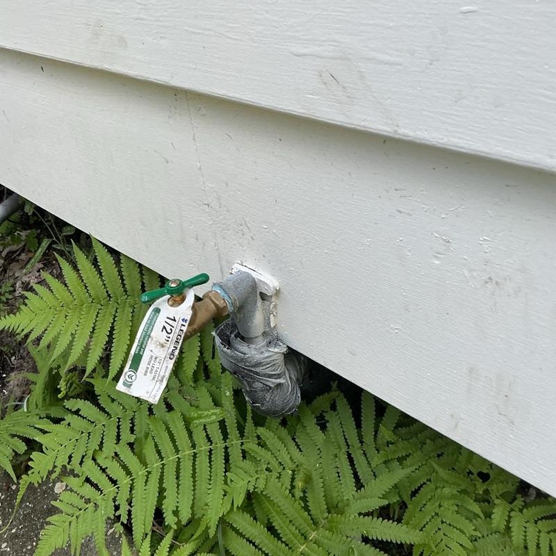Exterior hose bib with new valve replacement near siding Exterior hose bib with new valve replacement near siding