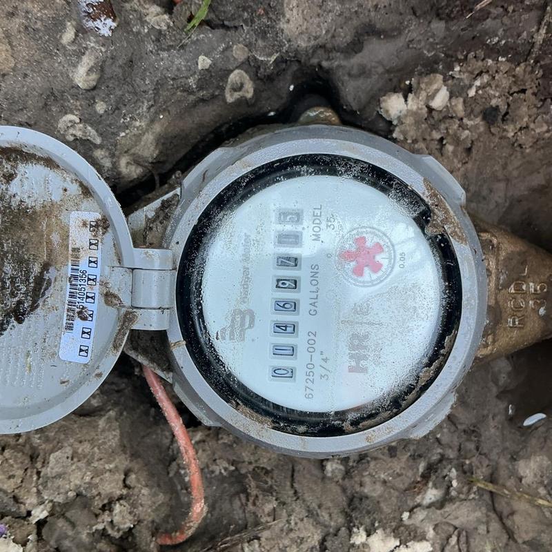 Water meter with iron pipe connection repair in soil Water meter with iron pipe connection repair in soil