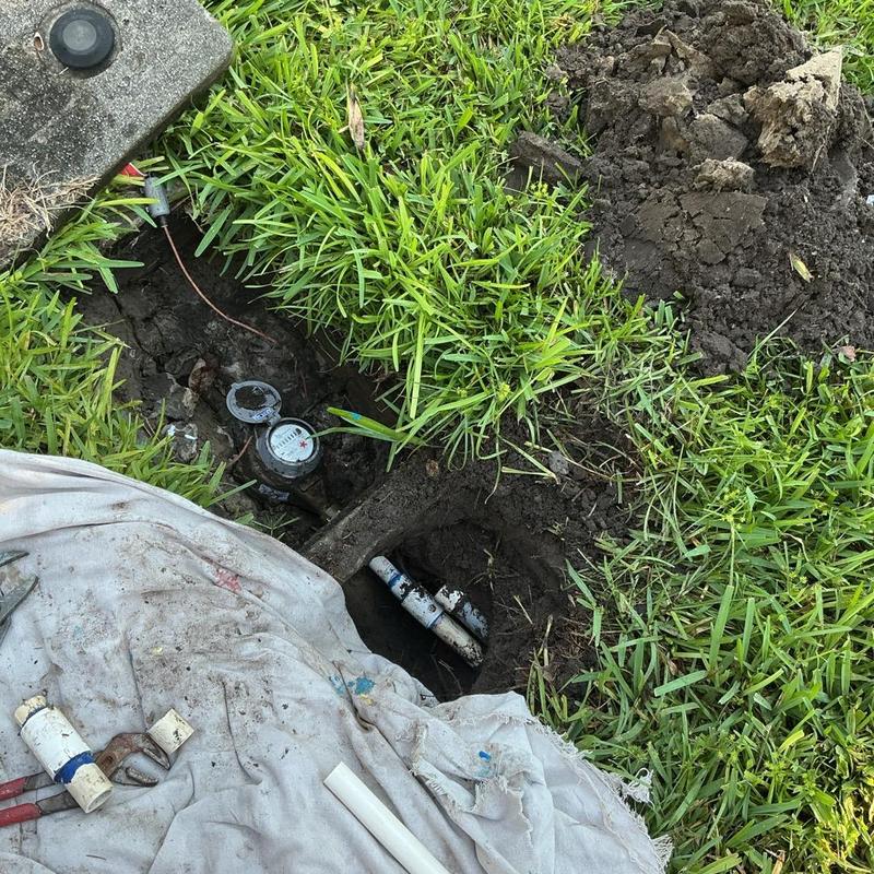 Water meter box and iron pipe leak repair in grass Water meter box and iron pipe leak repair in grass
