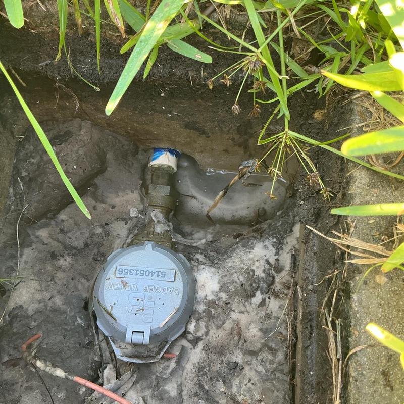 Water meter iron pipe connection with leak repair Water meter iron pipe connection with leak repair