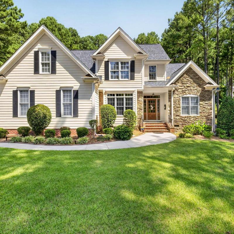 Home exterior with siding and stone facade addition Home exterior with siding and stone facade addition