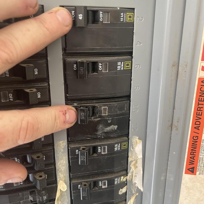 Electrical breaker panel with finger checking breakers Electrical breaker panel with finger checking breakers