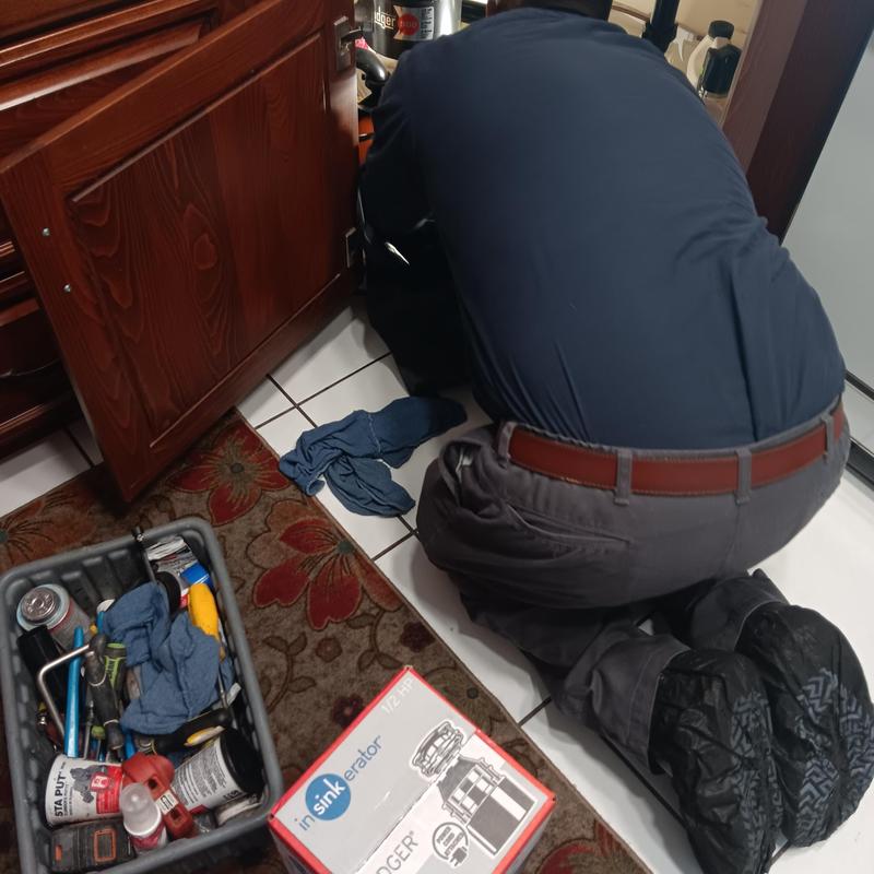 Garbage disposal installation under kitchen sink Garbage disposal installation under kitchen sink