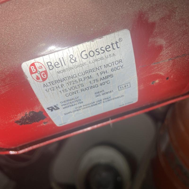 Hot water circulating pump motor label on red housing Hot water circulating pump motor label on red housing