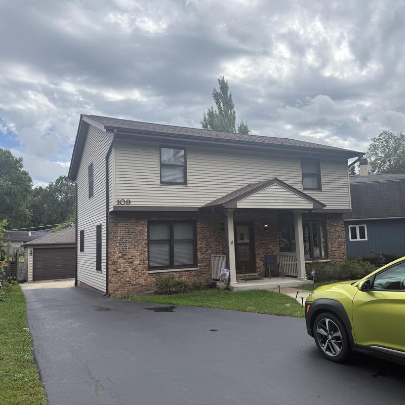 Atlas Pinnacle Pristine roof with gutters and skylights
