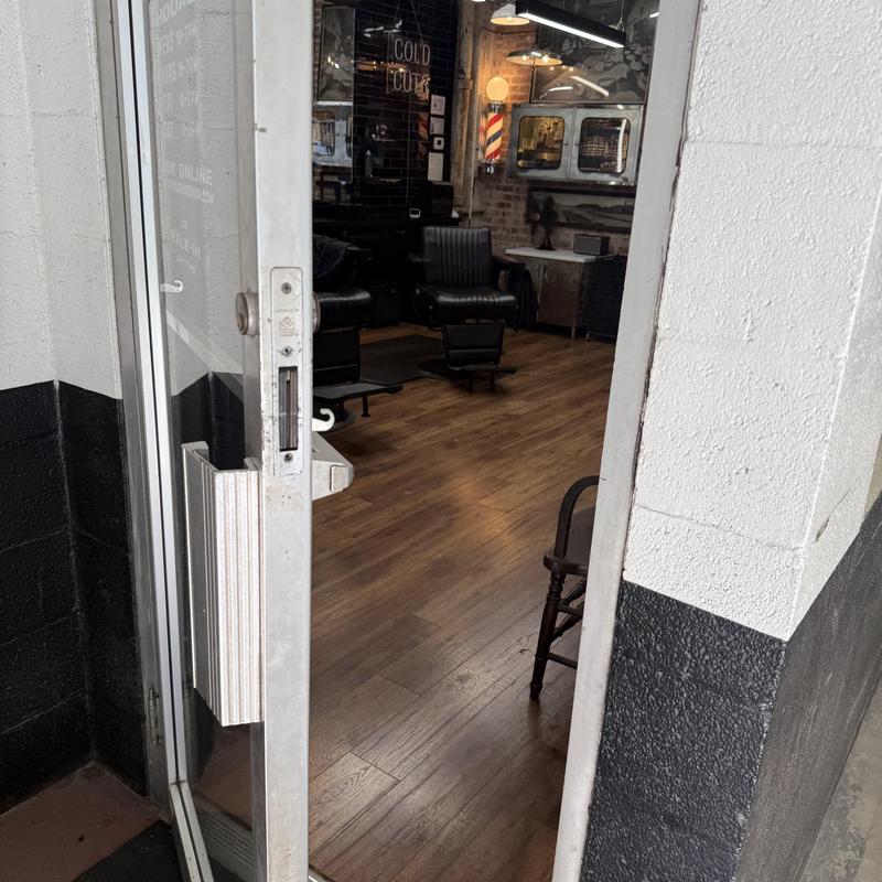 Storefront door lock rekey at barbershop entrance Storefront door lock rekey at barbershop entrance