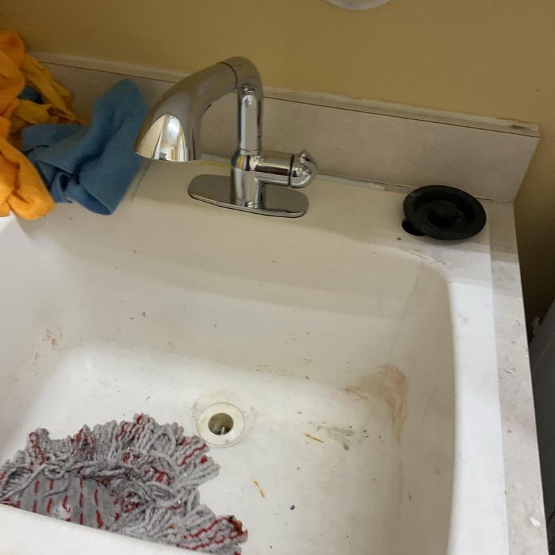 Laundry sink faucet and basin with mop inside Laundry sink faucet and basin with mop inside