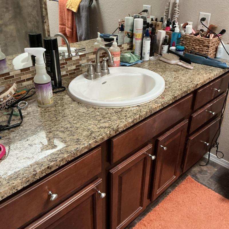 Bathroom sink faucet and granite countertop with supplies Bathroom sink faucet and granite countertop with supplies