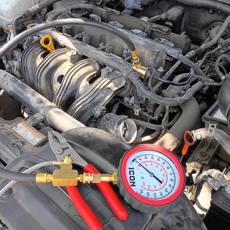 Fuel pump pressure test with gauge on engine bay Fuel pump pressure test with gauge on engine bay