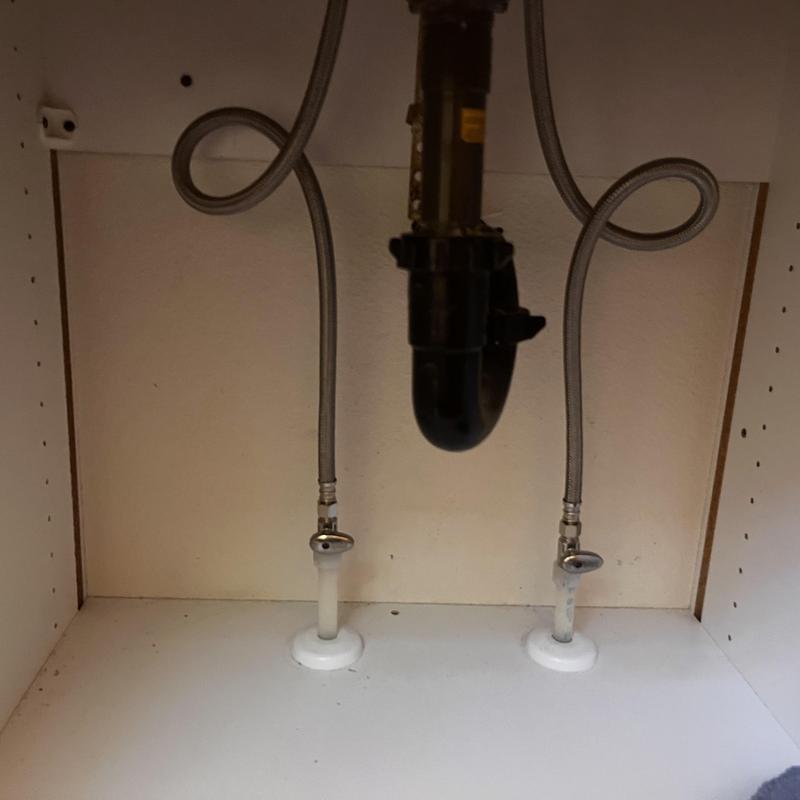 Angle stop valves with supply lines under sink cabinet Angle stop valves with supply lines under sink cabinet