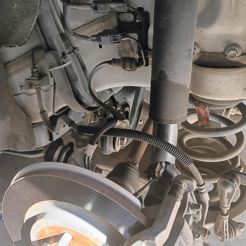 Rear shock absorber and brake rotor assembly on Ford Explorer Rear shock absorber and brake rotor assembly on Ford Explorer