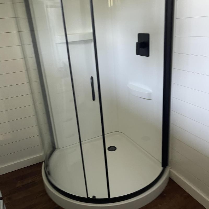 Shower enclosure with black frame and glass doors Shower enclosure with black frame and glass doors