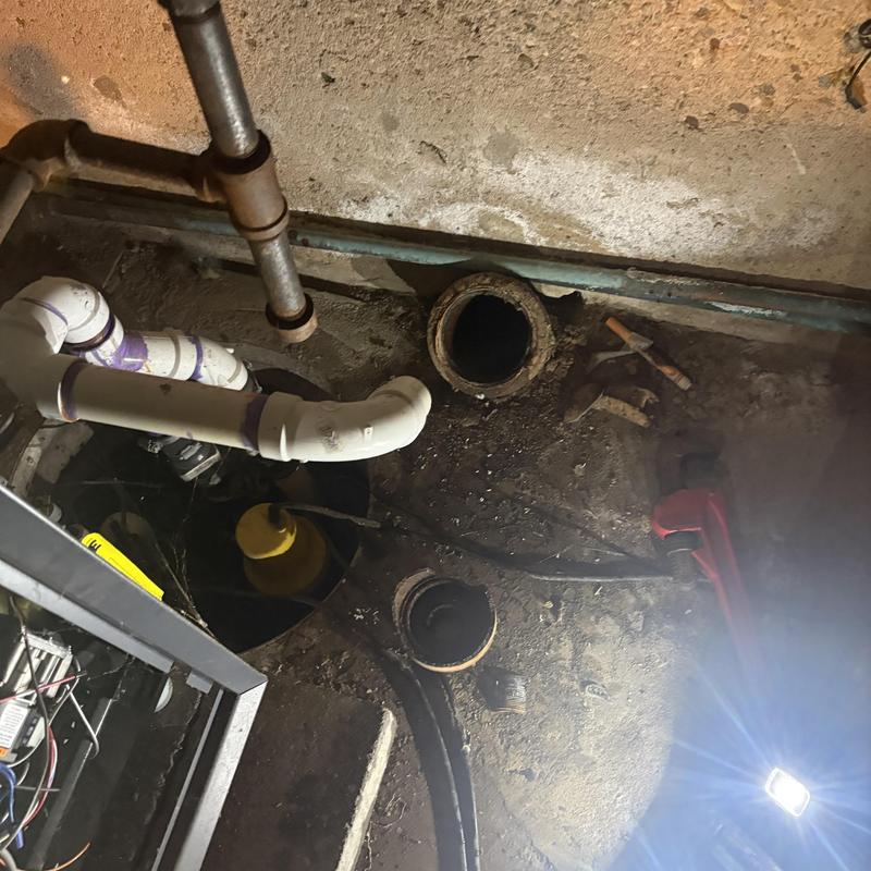 Main line sewer pipes and sump pump basin installation Main line sewer pipes and sump pump basin installation