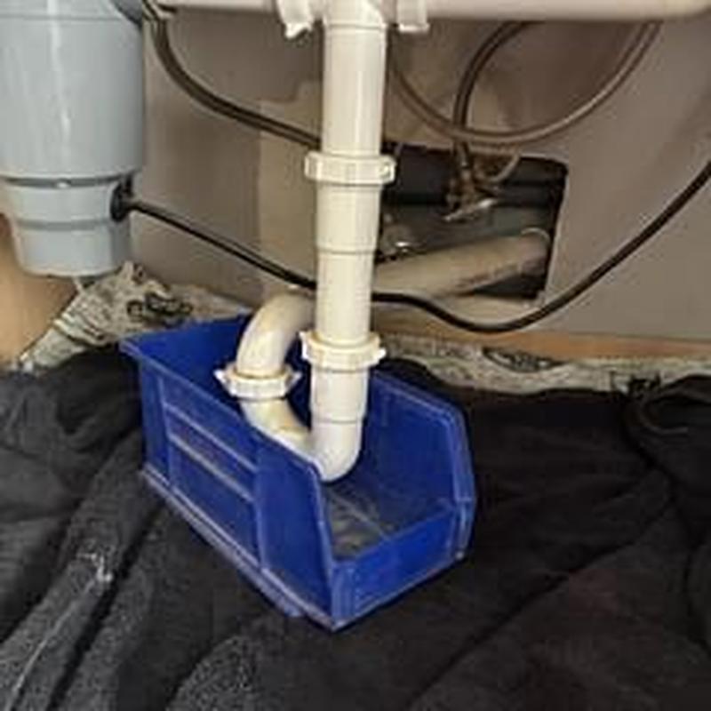 Kitchen sink drain pipe with blue catch basin