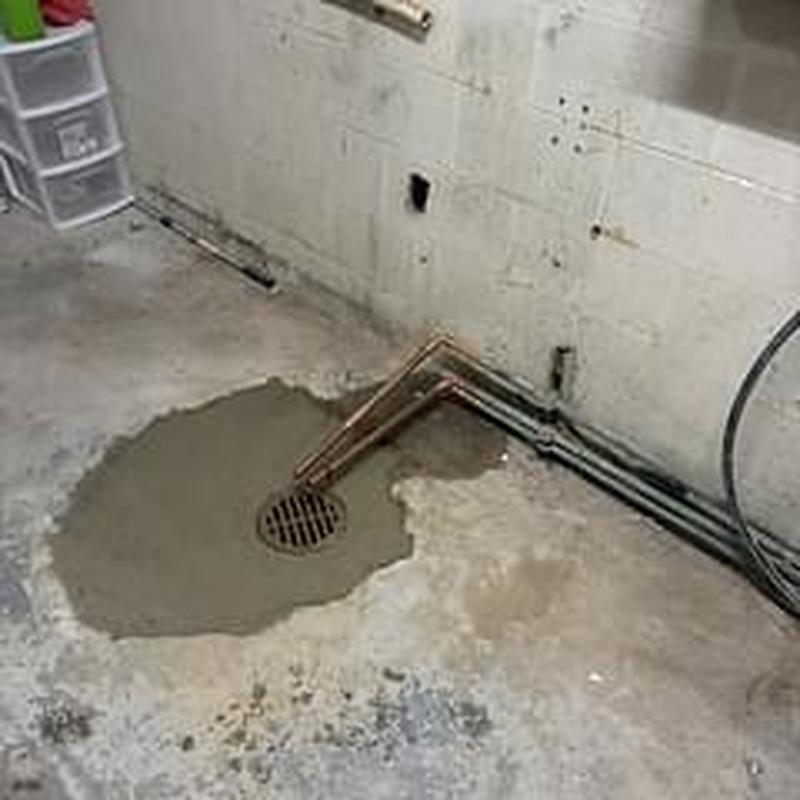 Floor drain with concrete patch in mechanical room