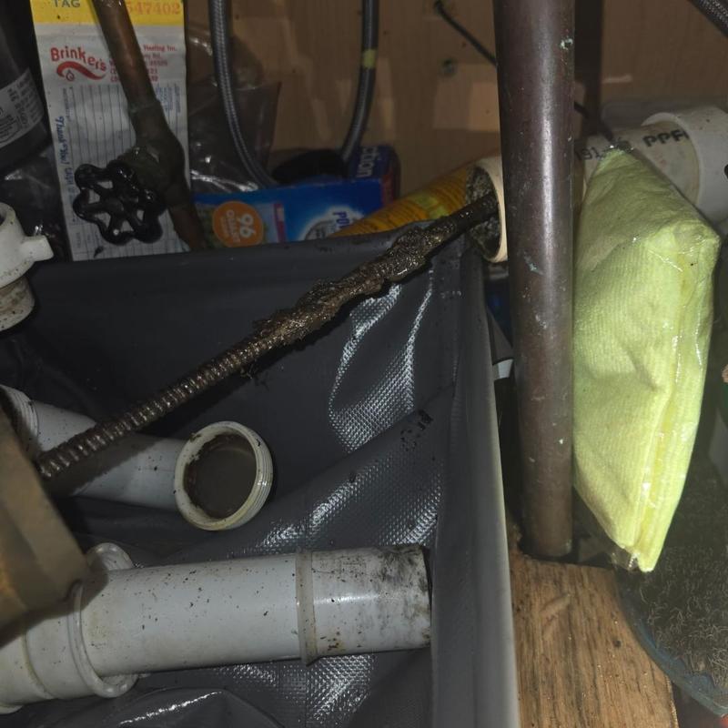 Kitchen drain cable with cleaning residue inside pipe Kitchen drain cable with cleaning residue inside pipe