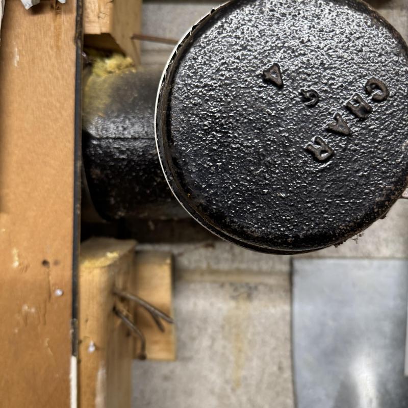 Cast iron main drain line cleanout in laundry room wall Cast iron main drain line cleanout in laundry room wall