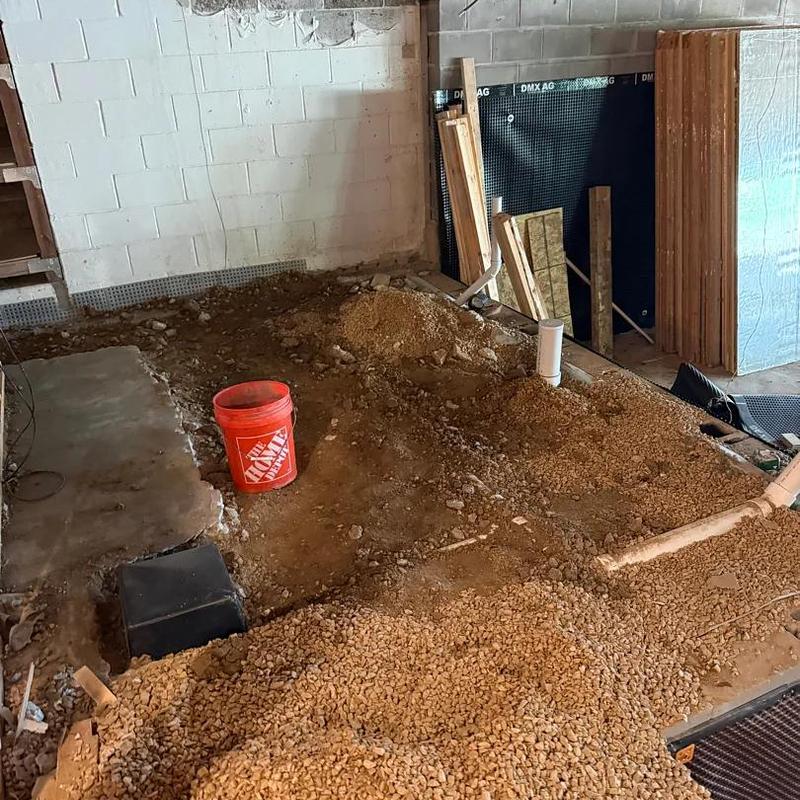 Basement plumbing repiping with gravel and PVC pipes