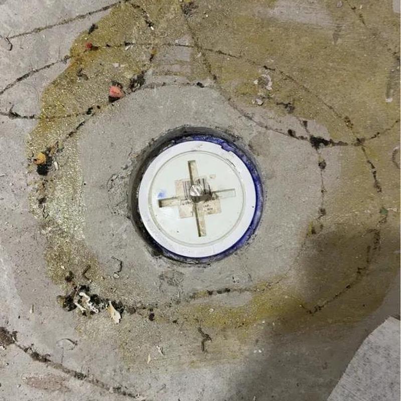 Cleanout pipe flush with concrete floor surface