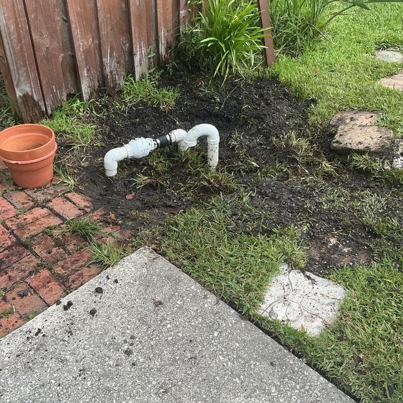 Yard drainage pump piping in backyard soil Yard drainage pump piping in backyard soil