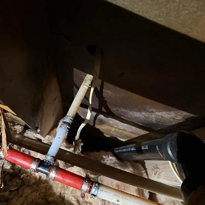 PEX water piping repair in crawl space with clamps PEX water piping repair in crawl space with clamps