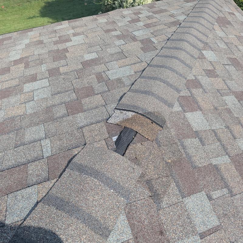 Owens Corning hip and ridge shingle damage on roof
