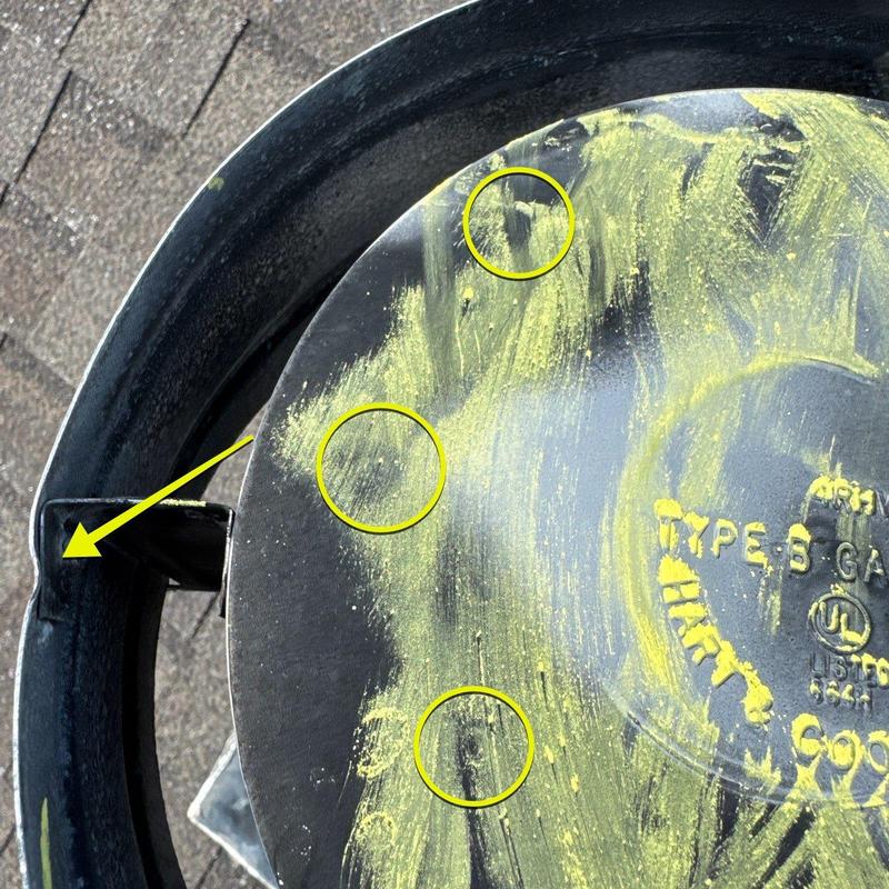 Gas valve cover with hail damage marked in yellow