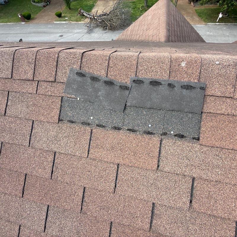 Roof shingles with hail damage and missing granules