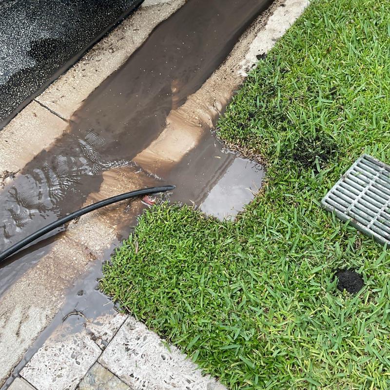 Residential storm drain hydro-jetting with water flow Residential storm drain hydro-jetting with water flow