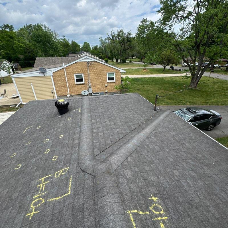 Asphalt shingle roof with hail damage markings