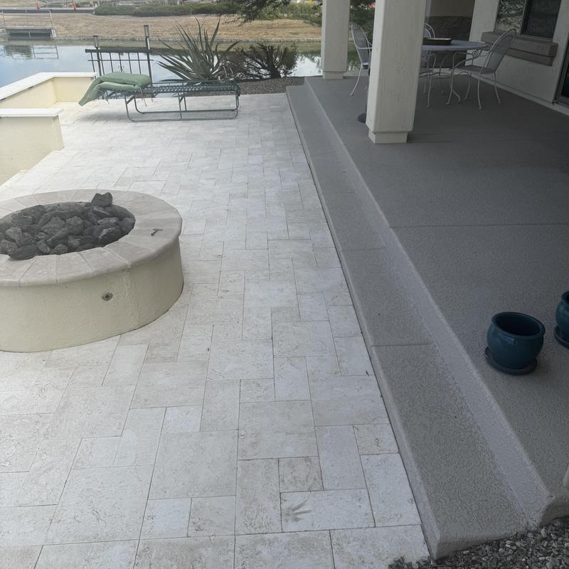 Stone patio tile installation near backyard fire pit Stone patio tile installation near backyard fire pit