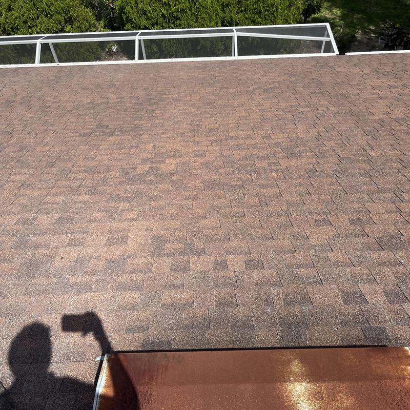 Shingle roof surface and rusted metal flashing Shingle roof surface and rusted metal flashing