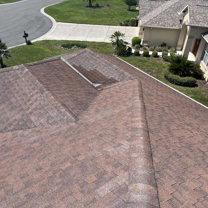 Shingle roof with faded and discolored areas Shingle roof with faded and discolored areas