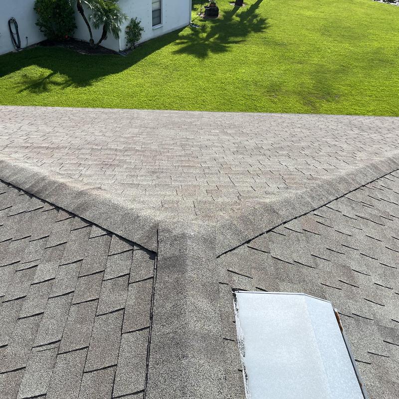 Shingle roof valley and ridge vent with metal flashing Shingle roof valley and ridge vent with metal flashing