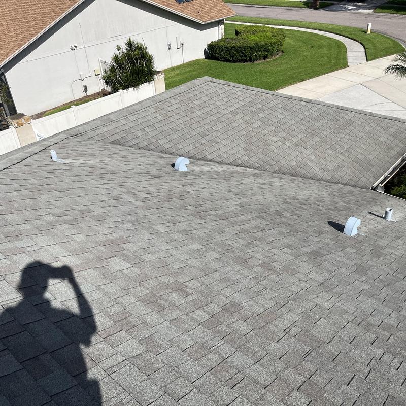 Gray shingle roof with ventilation pipes and valleys Gray shingle roof with ventilation pipes and valleys