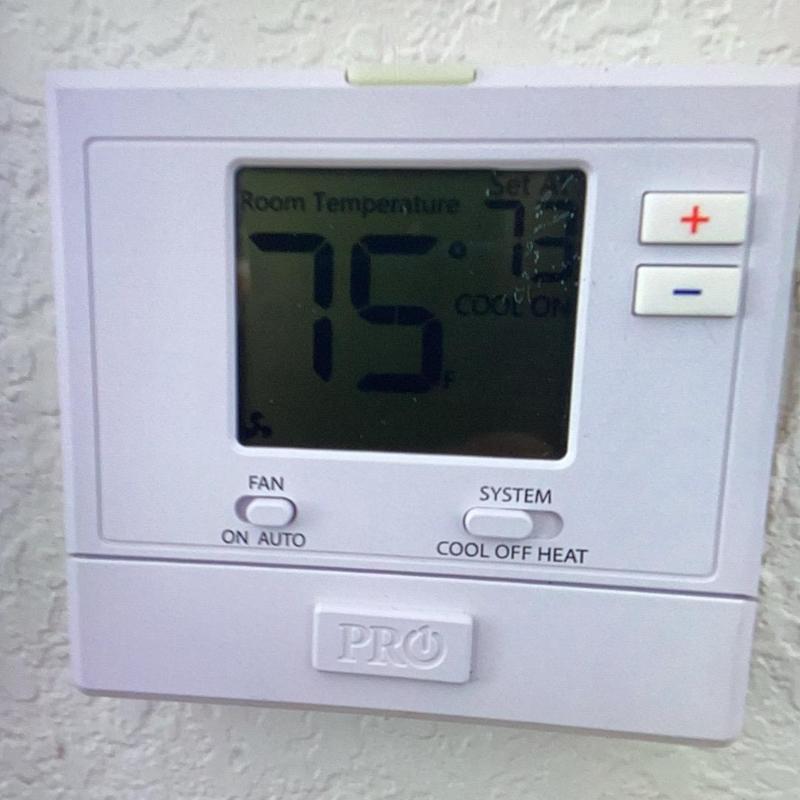 Digital thermostat set to cooling mode at 75°F Digital thermostat set to cooling mode at 75°F