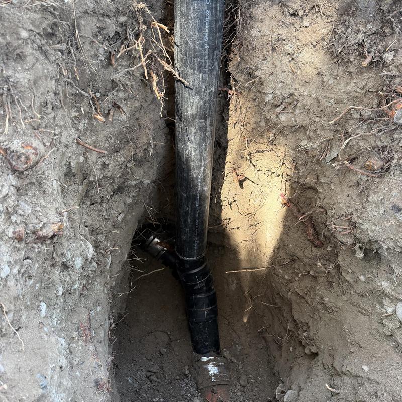 ABS sewer clean out installation in deep trench ABS sewer clean out installation in deep trench