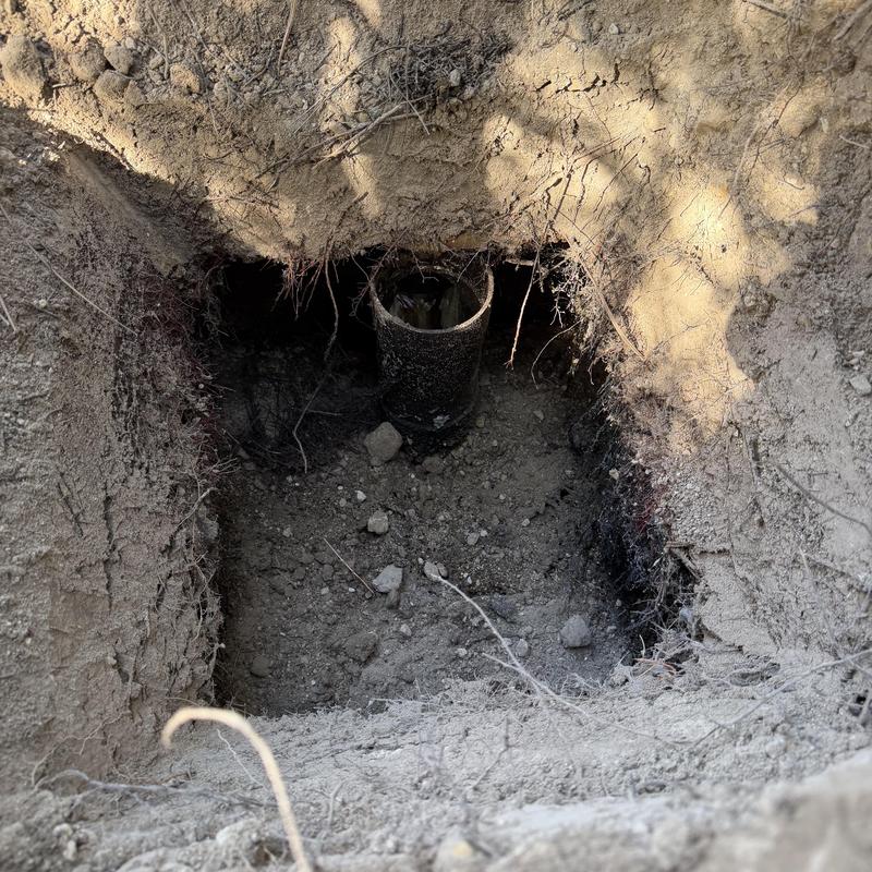 Septic tank inlet riser installation in dirt pit Septic tank inlet riser installation in dirt pit