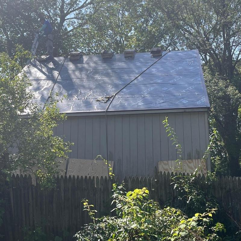 Roof underlayment installation on residential shed