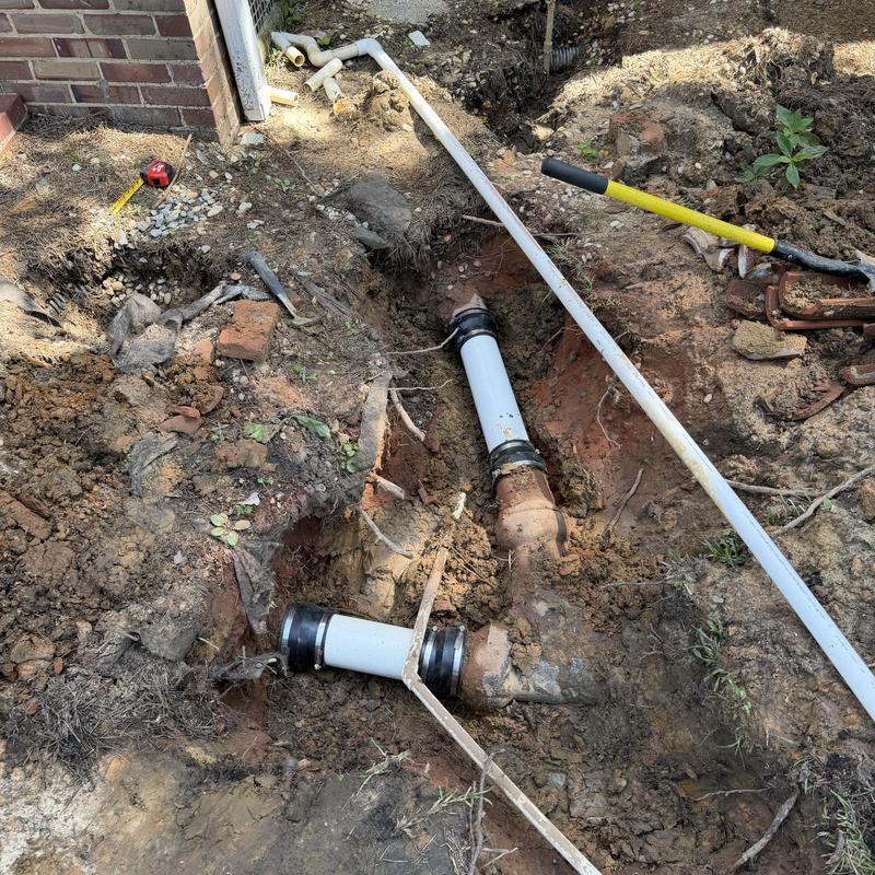 Clay sewer line with PVC repair couplings exposed Clay sewer line with PVC repair couplings exposed